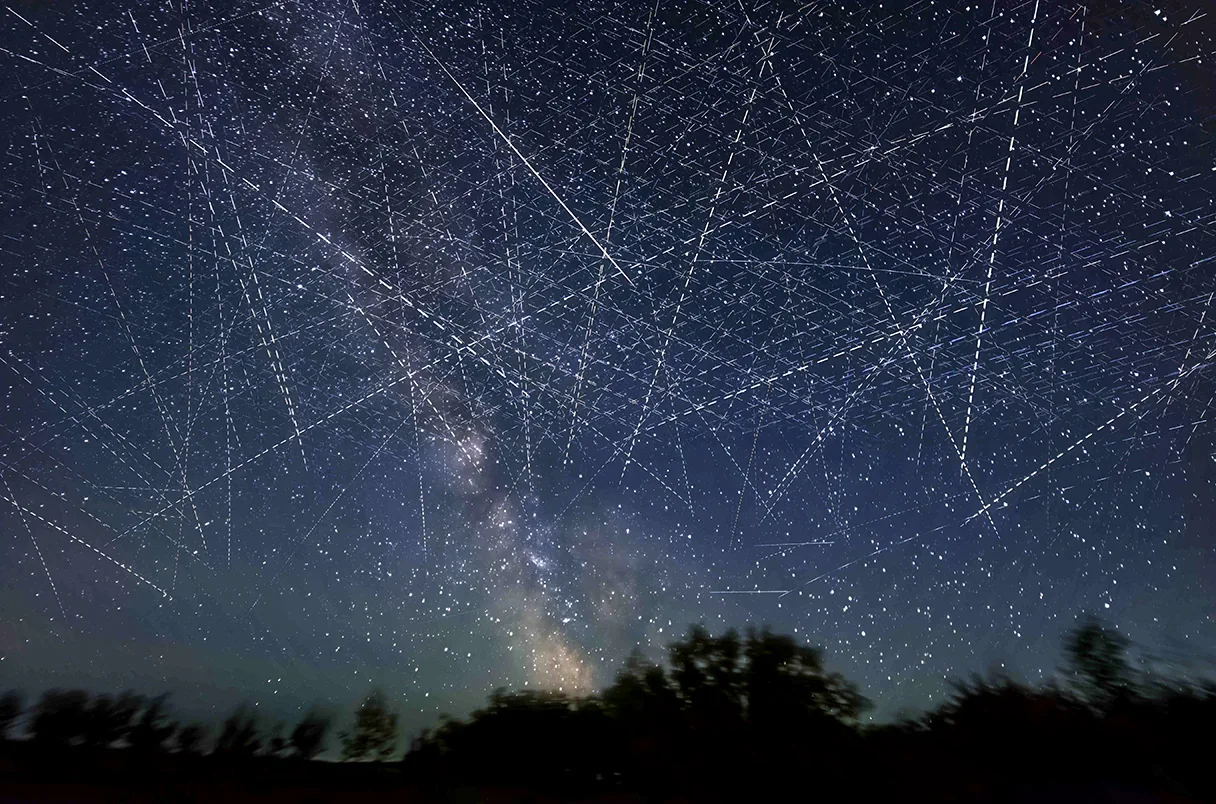Clear night sky above a rural property, the unobstructed view Starlink needs